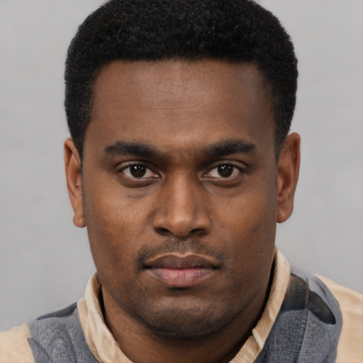 Neutral latino young-adult male with short  brown hair and brown eyes