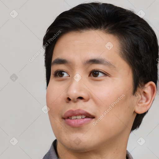 Joyful asian young-adult male with short  brown hair and brown eyes