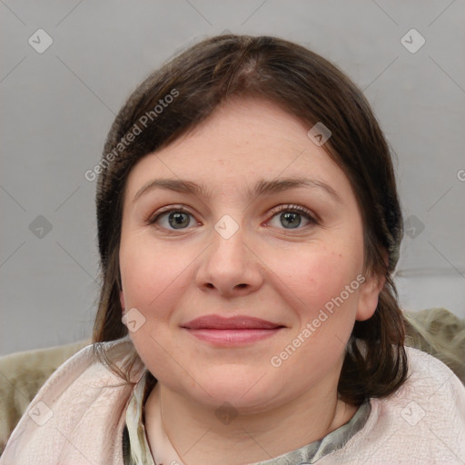 Joyful white young-adult female with medium  brown hair and blue eyes