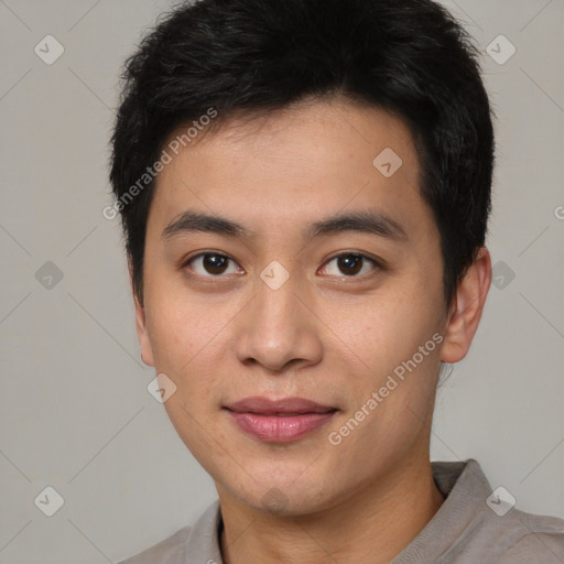 Joyful white young-adult male with short  black hair and brown eyes