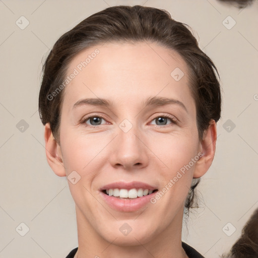 Joyful white young-adult female with medium  brown hair and grey eyes