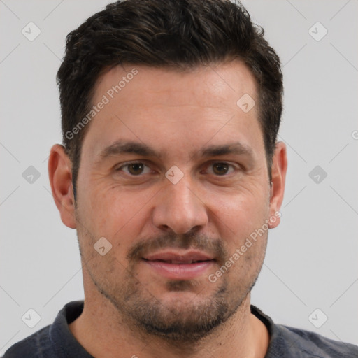 Joyful white adult male with short  brown hair and brown eyes