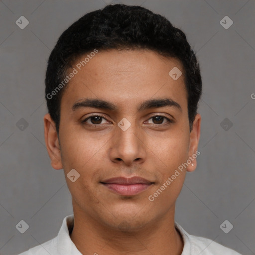 Joyful latino young-adult male with short  brown hair and brown eyes