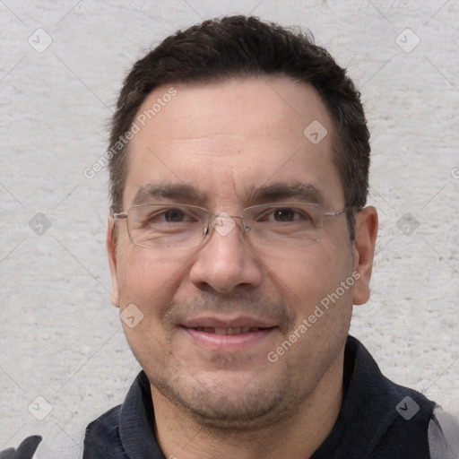 Joyful white adult male with short  brown hair and brown eyes