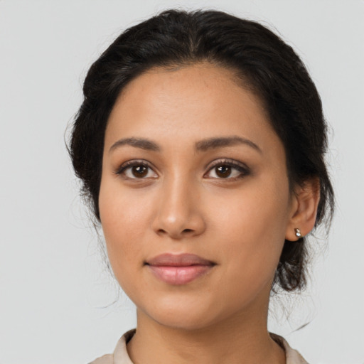 Neutral latino young-adult female with medium  black hair and brown eyes