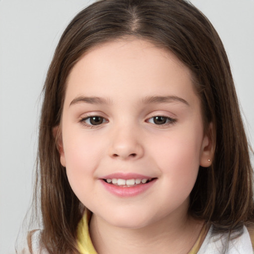 Joyful white child female with medium  brown hair and brown eyes