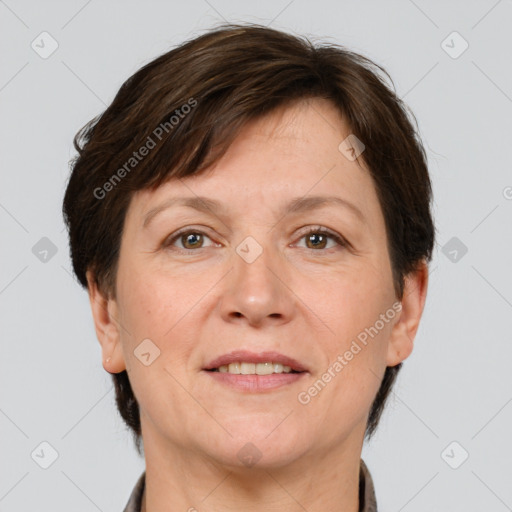 Joyful white adult female with short  brown hair and brown eyes