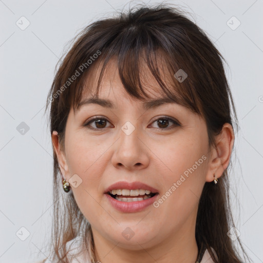 Joyful white young-adult female with long  brown hair and brown eyes