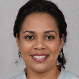 Joyful white adult female with short  brown hair and brown eyes