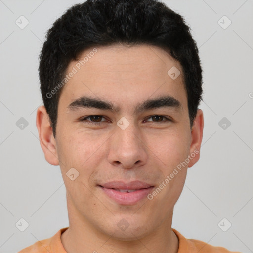 Joyful latino young-adult male with short  brown hair and brown eyes