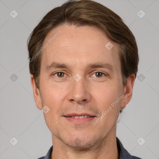 Joyful white adult male with short  brown hair and grey eyes