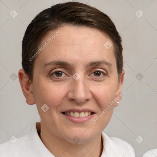 Joyful white adult female with short  brown hair and grey eyes