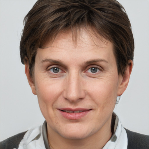 Joyful white adult female with short  brown hair and brown eyes