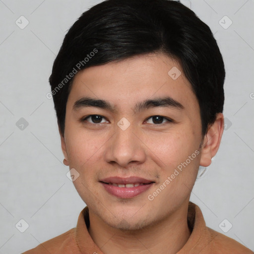 Joyful asian young-adult male with short  black hair and brown eyes