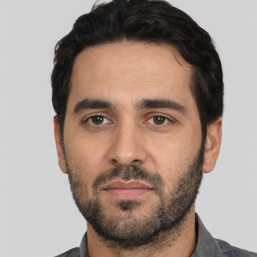 Neutral white young-adult male with short  black hair and brown eyes