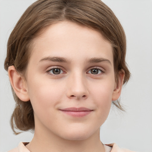 Joyful white child female with medium  brown hair and grey eyes