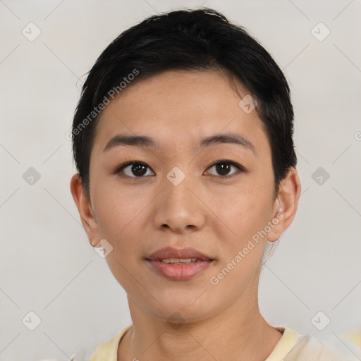 Joyful asian young-adult female with short  black hair and brown eyes