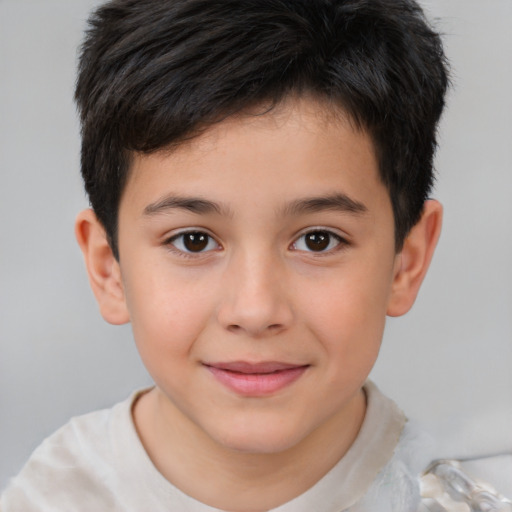 Joyful white child male with short  brown hair and brown eyes