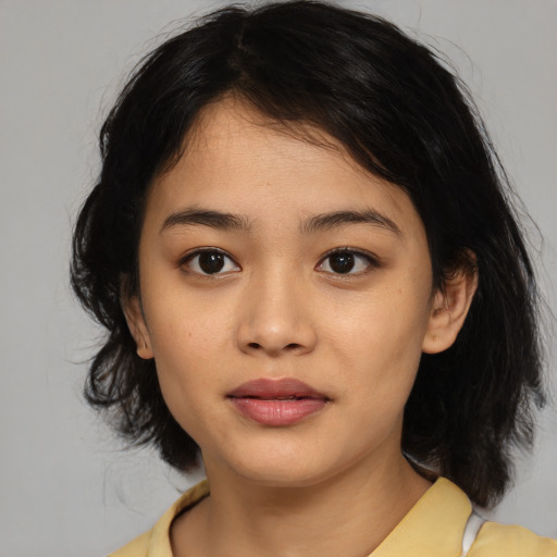 Neutral asian young-adult female with medium  black hair and brown eyes