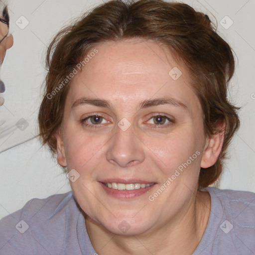 Joyful white adult female with medium  brown hair and blue eyes