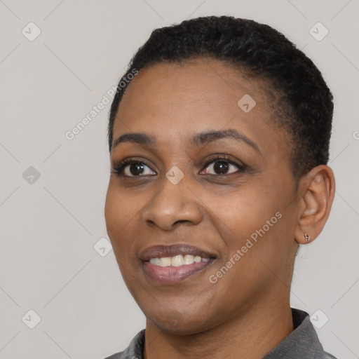 Joyful black young-adult female with short  black hair and brown eyes