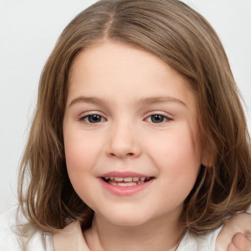 Joyful white child female with medium  brown hair and brown eyes