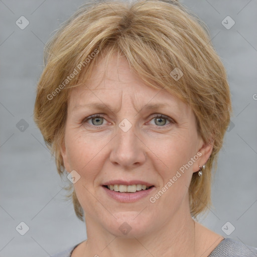 Joyful white adult female with medium  brown hair and blue eyes