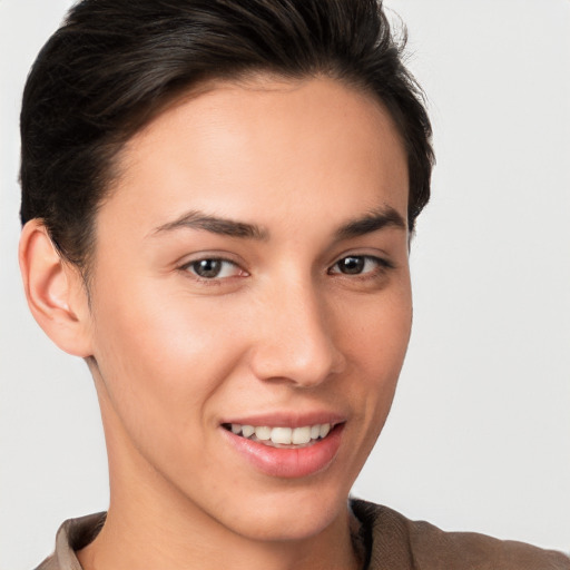 Joyful white young-adult female with short  brown hair and brown eyes