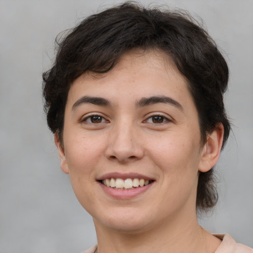 Joyful white young-adult female with medium  brown hair and brown eyes