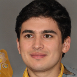 Joyful latino young-adult male with short  brown hair and brown eyes