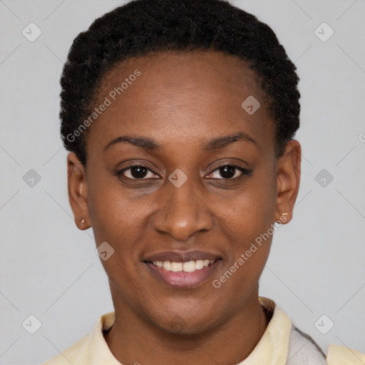 Joyful black young-adult female with short  black hair and brown eyes