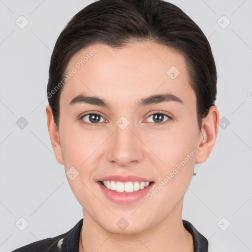 Joyful white young-adult female with short  brown hair and brown eyes