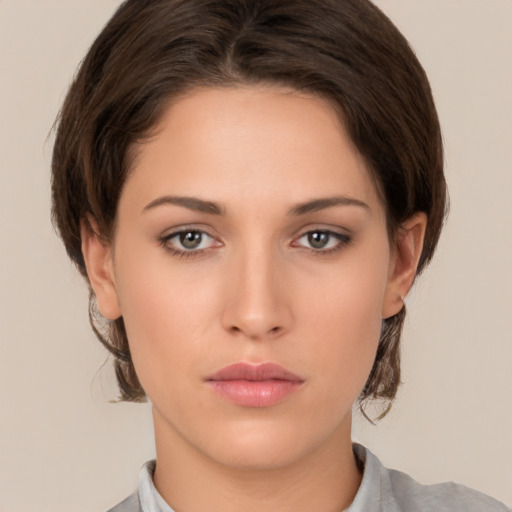 Neutral white young-adult female with medium  brown hair and brown eyes