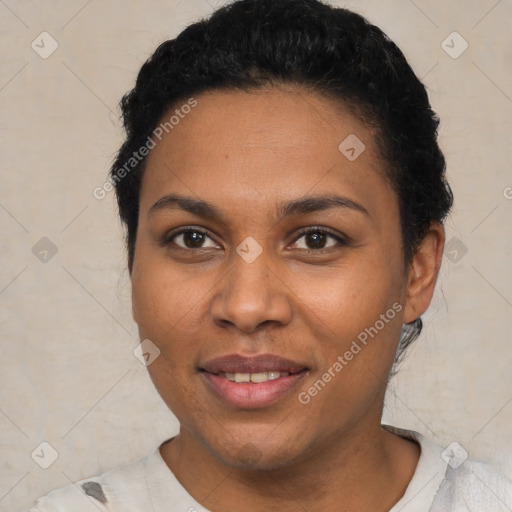 Joyful black young-adult female with short  black hair and brown eyes