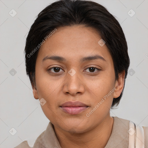 Joyful latino young-adult female with medium  brown hair and brown eyes