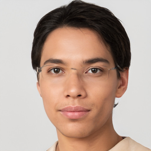 Joyful asian young-adult male with short  brown hair and brown eyes