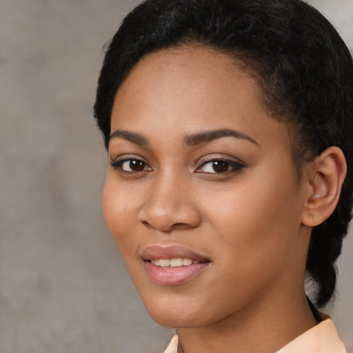 Joyful latino young-adult female with short  black hair and brown eyes