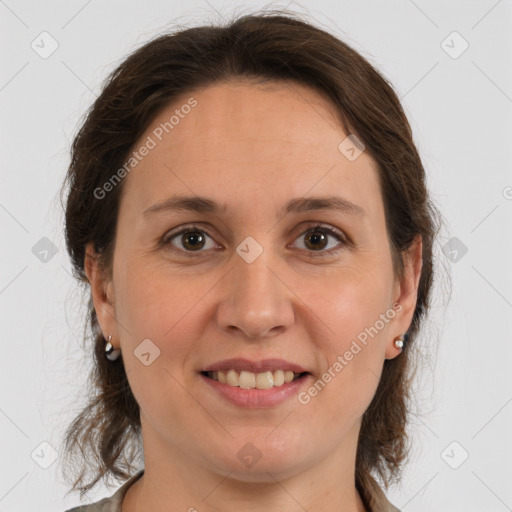 Joyful white young-adult female with medium  brown hair and grey eyes