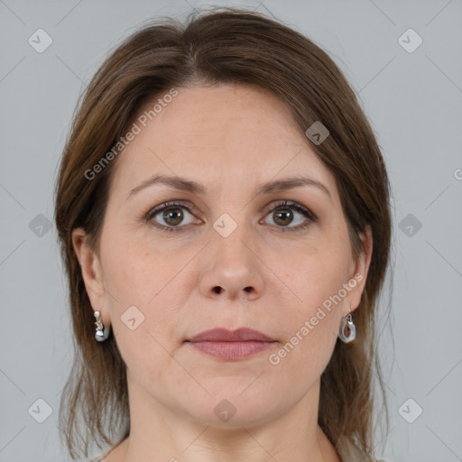 Joyful white adult female with medium  brown hair and grey eyes