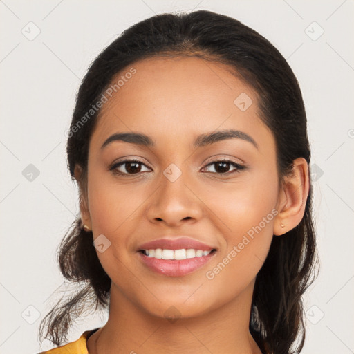 Joyful latino young-adult female with long  brown hair and brown eyes