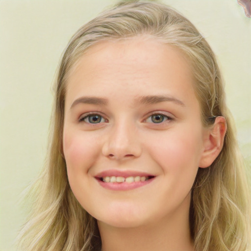 Joyful white young-adult female with long  brown hair and blue eyes