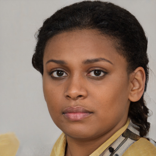 Neutral black young-adult female with short  brown hair and brown eyes
