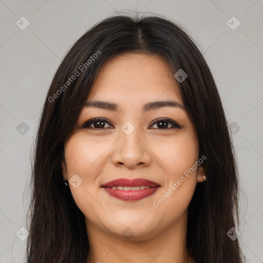 Joyful latino young-adult female with long  brown hair and brown eyes