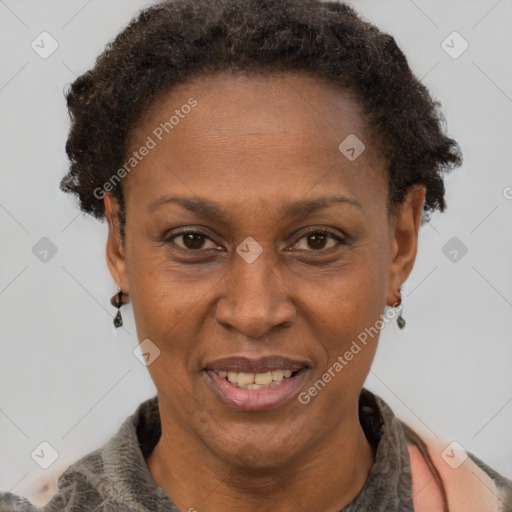 Joyful black adult female with short  brown hair and brown eyes