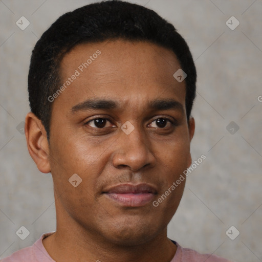 Joyful black young-adult male with short  brown hair and brown eyes