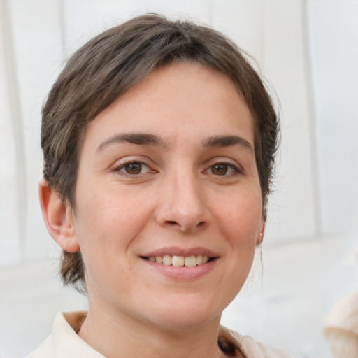 Joyful white young-adult female with medium  brown hair and brown eyes