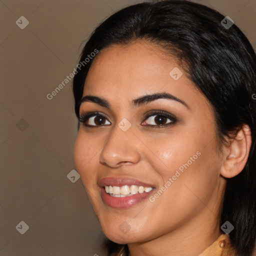 Joyful latino young-adult female with long  brown hair and brown eyes