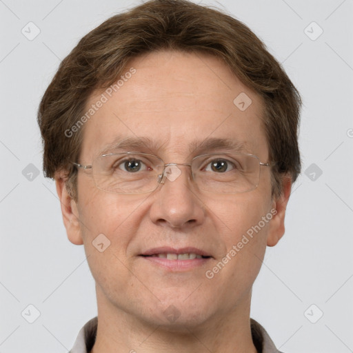 Joyful white adult male with short  brown hair and grey eyes