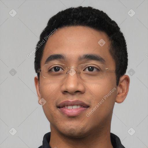 Joyful latino young-adult male with short  black hair and brown eyes