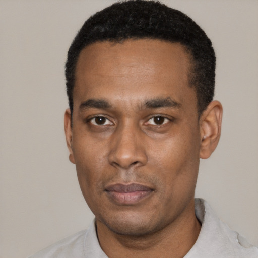 Neutral black young-adult male with short  black hair and brown eyes
